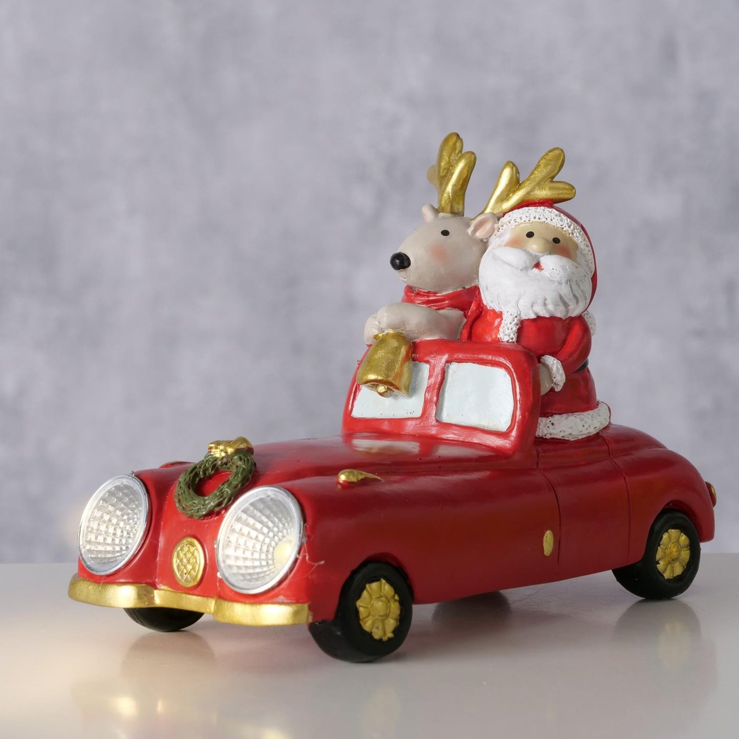 Auto Boltze con cervo e Babbo Natale LED in resina 14 cm