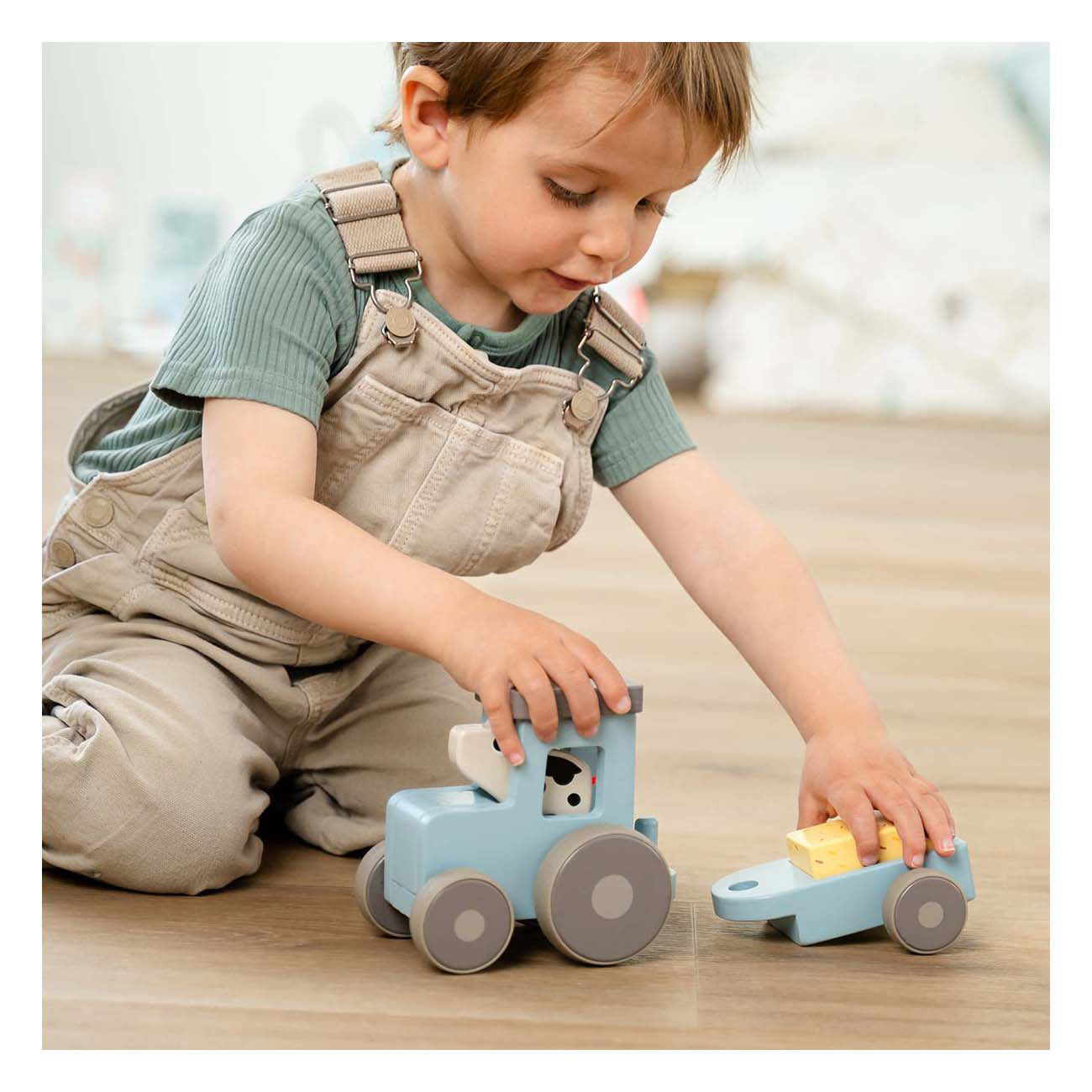 Hecho por ciervos Tiny Farm Tractor de madera Dotti azul