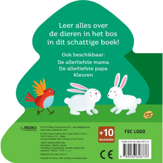 Libro de cartón con animales en el bosque.