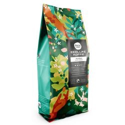 I chicchi di caffè pizzicano l'arrosto mamao-scuro