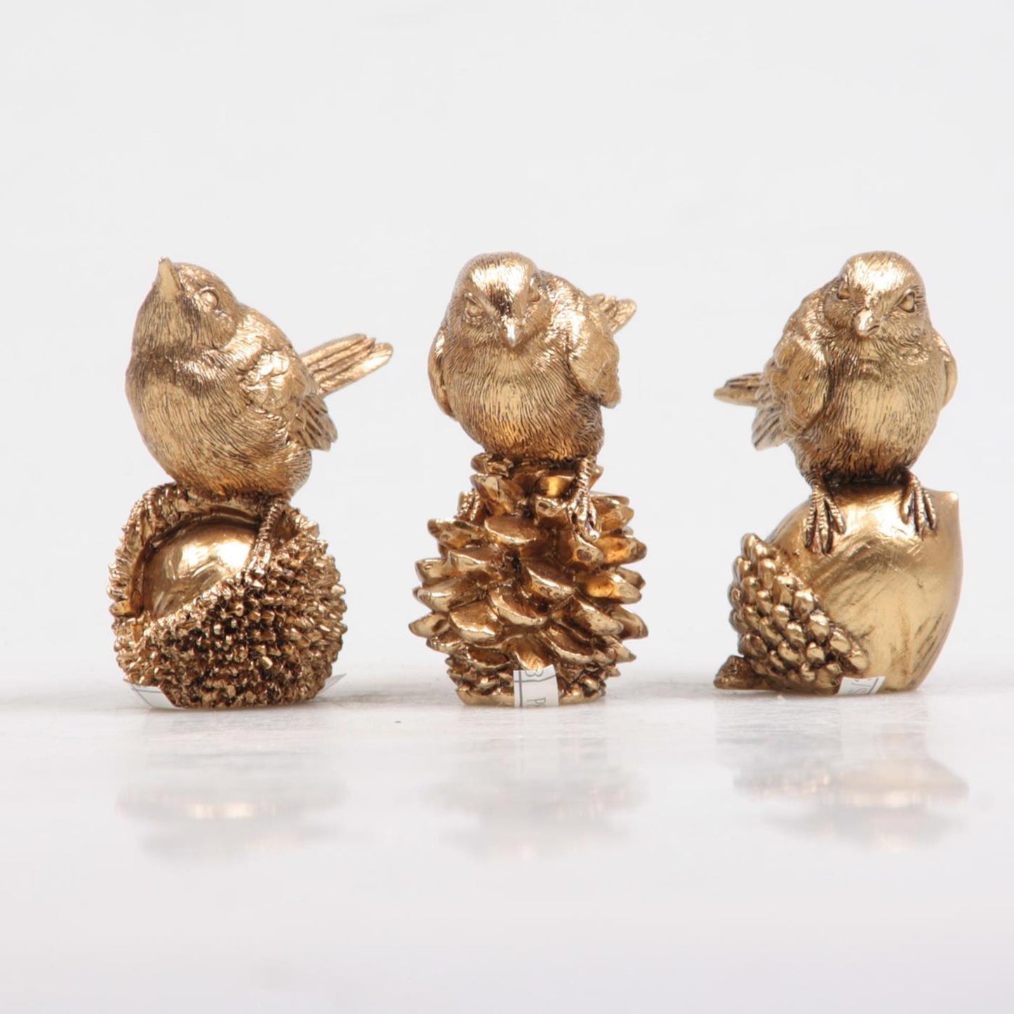 Decoración inspirada en la temporada, pájaro sobre nuez, dorado 5x3x6 cm