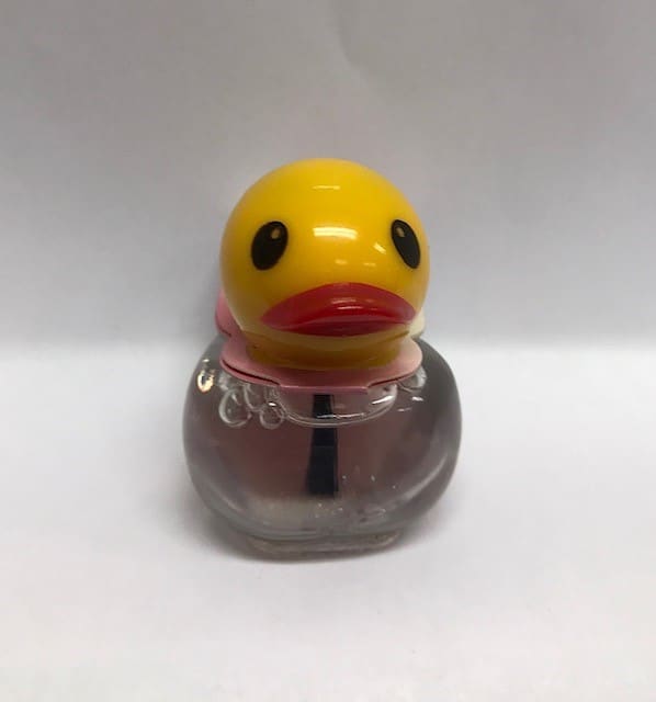 Esmalte de uñas con brillo en botella en forma de pato