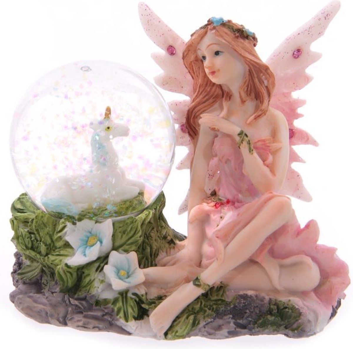 Fairy de flores sentada con un globo de nieve