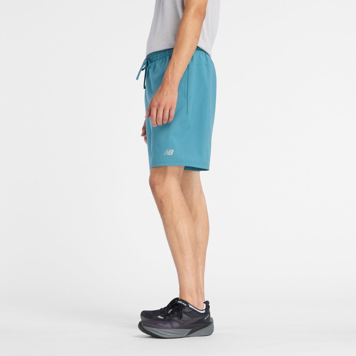 New balance sport essentials short 7 heren sportbroek - big teal