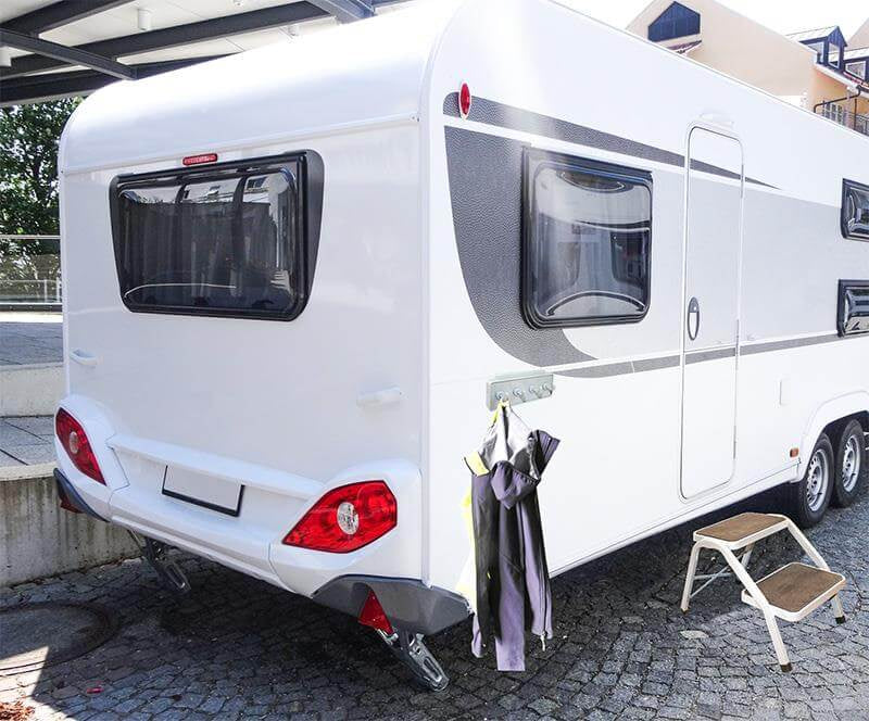 Coat rack for rail system caravan