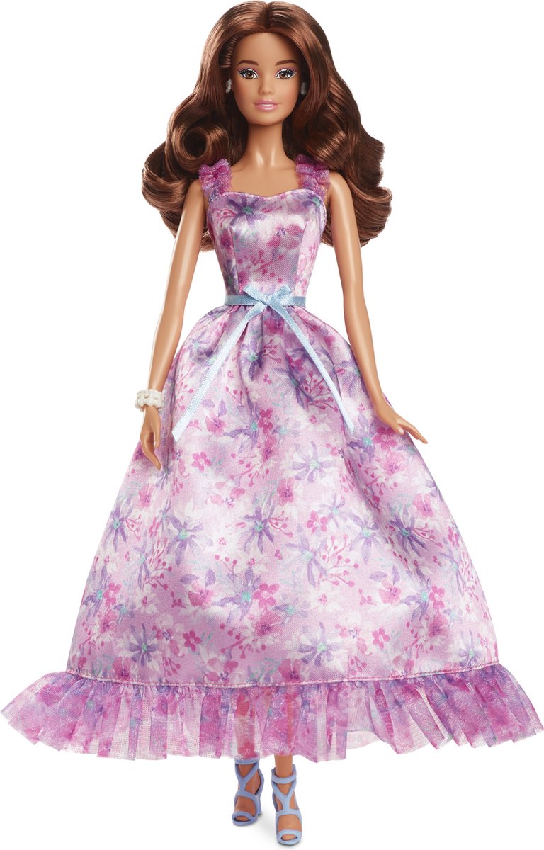 Mattel firma bambola con capelli biondi e serata in bianco e nero