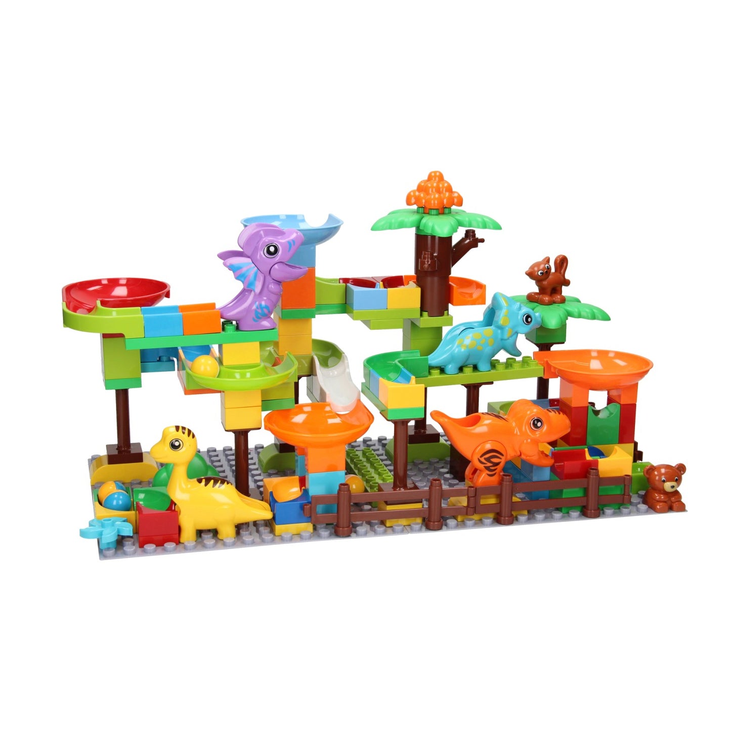 Bloques de construcción y dinosaurio con pista de mármol.