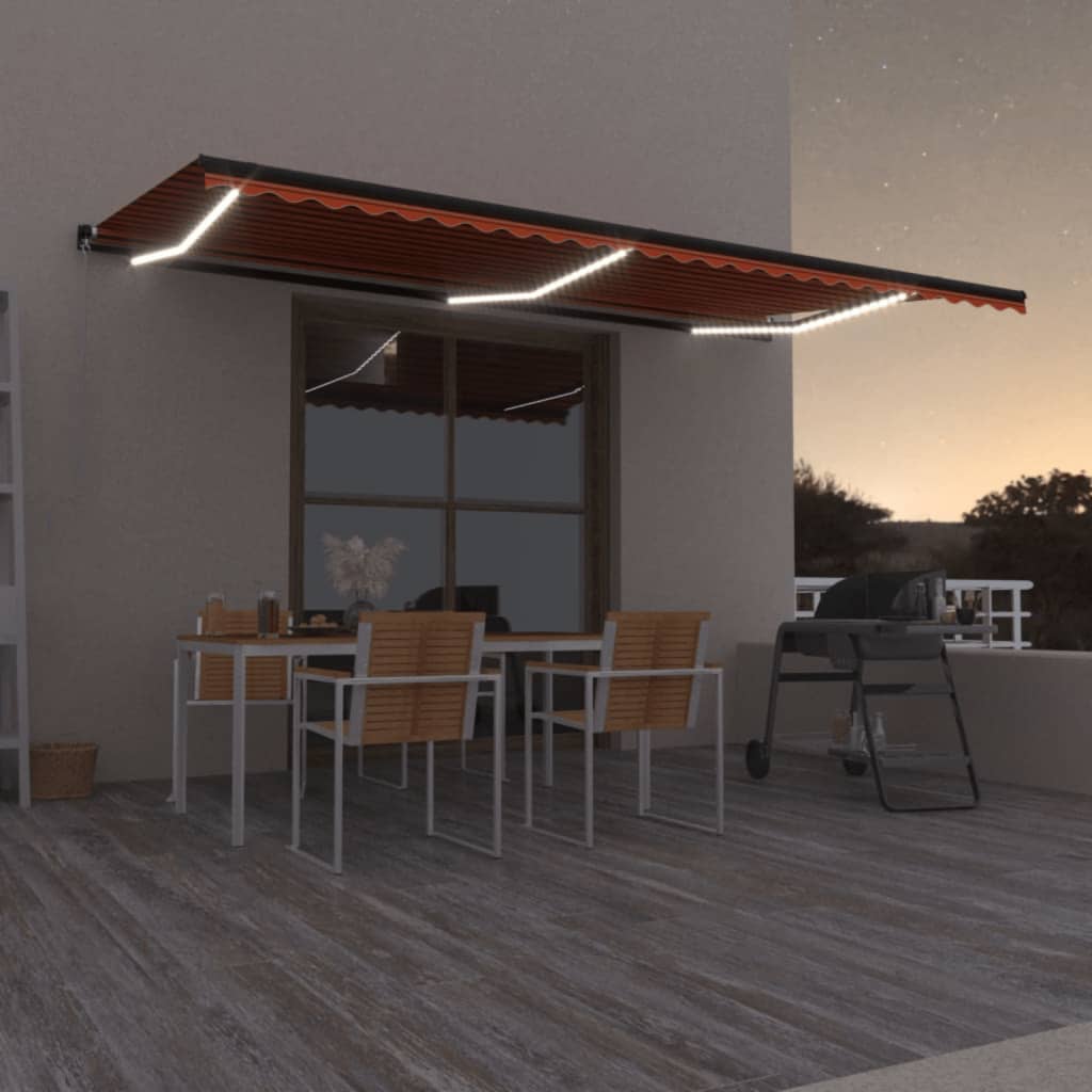 Vidaxl Luifel estendibile manualmente con arancione LED 600x350 cm e marrone