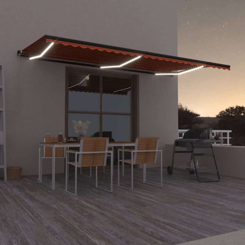 Vidaxl Luifel estendibile manualmente con arancione LED 600x350 cm e marrone