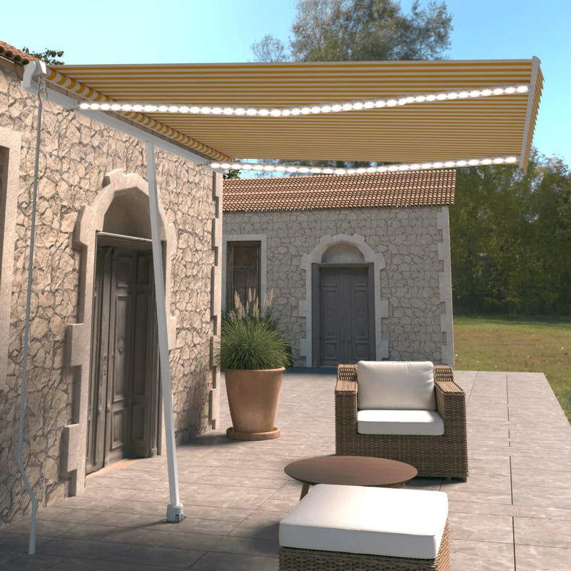 Vidaxl Luifel estendibile manualmente con LED 300x250 cm giallo e bianco