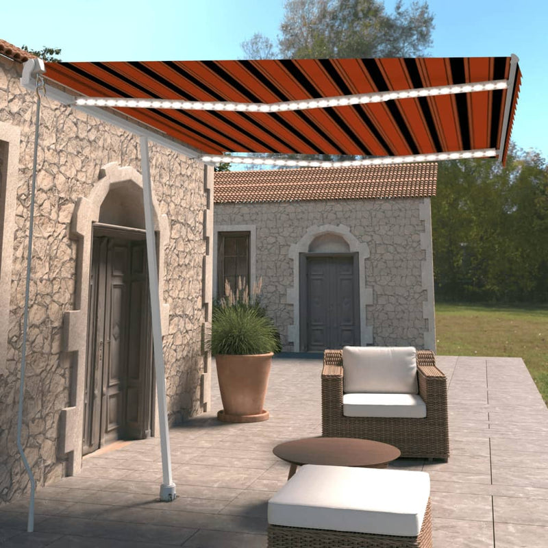 Vidaxl Luifel estendibile manualmente con arancione da 300x250 cm a LED e marrone