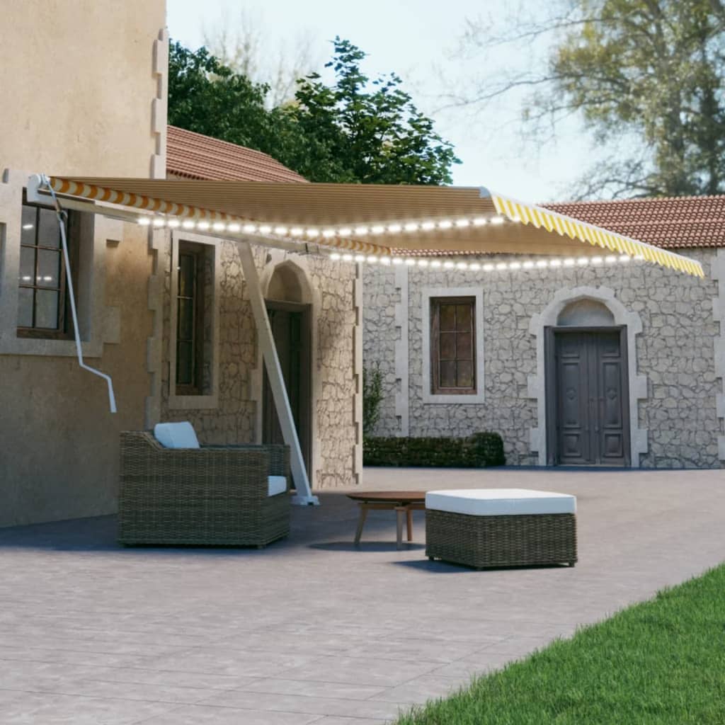 Vidaxl Luifel estendibile manualmente con LED 500x300 cm giallo e bianco