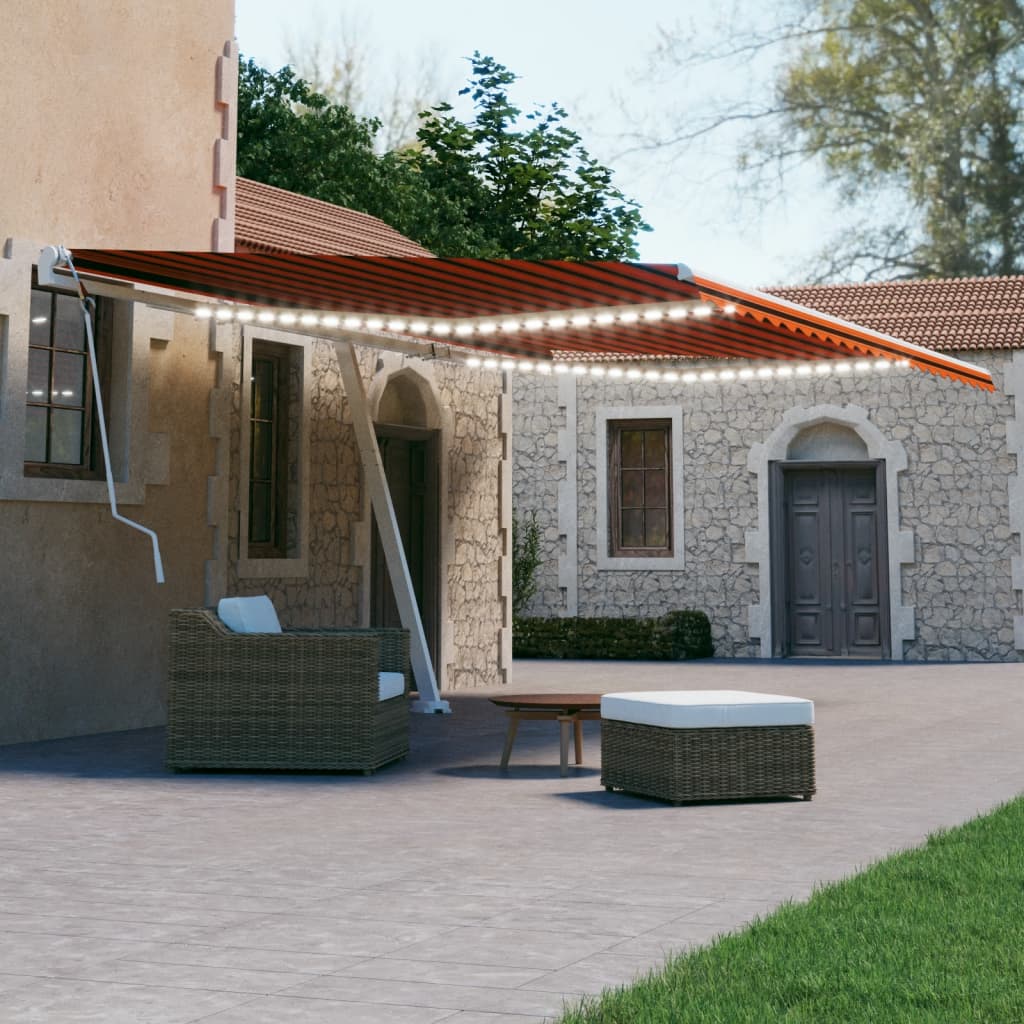 Vidaxl Luifel estendibile manualmente con arancione LED 600x300 cm e marrone