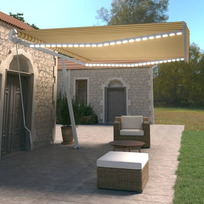 Vidaxl Luifel estendibile manualmente con LED 500x350 cm giallo e bianco
