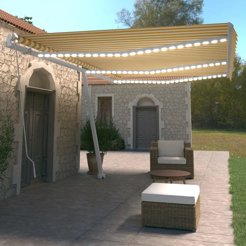 Vidaxl Luifel estendibile manualmente con LED 600x350 cm giallo e bianco