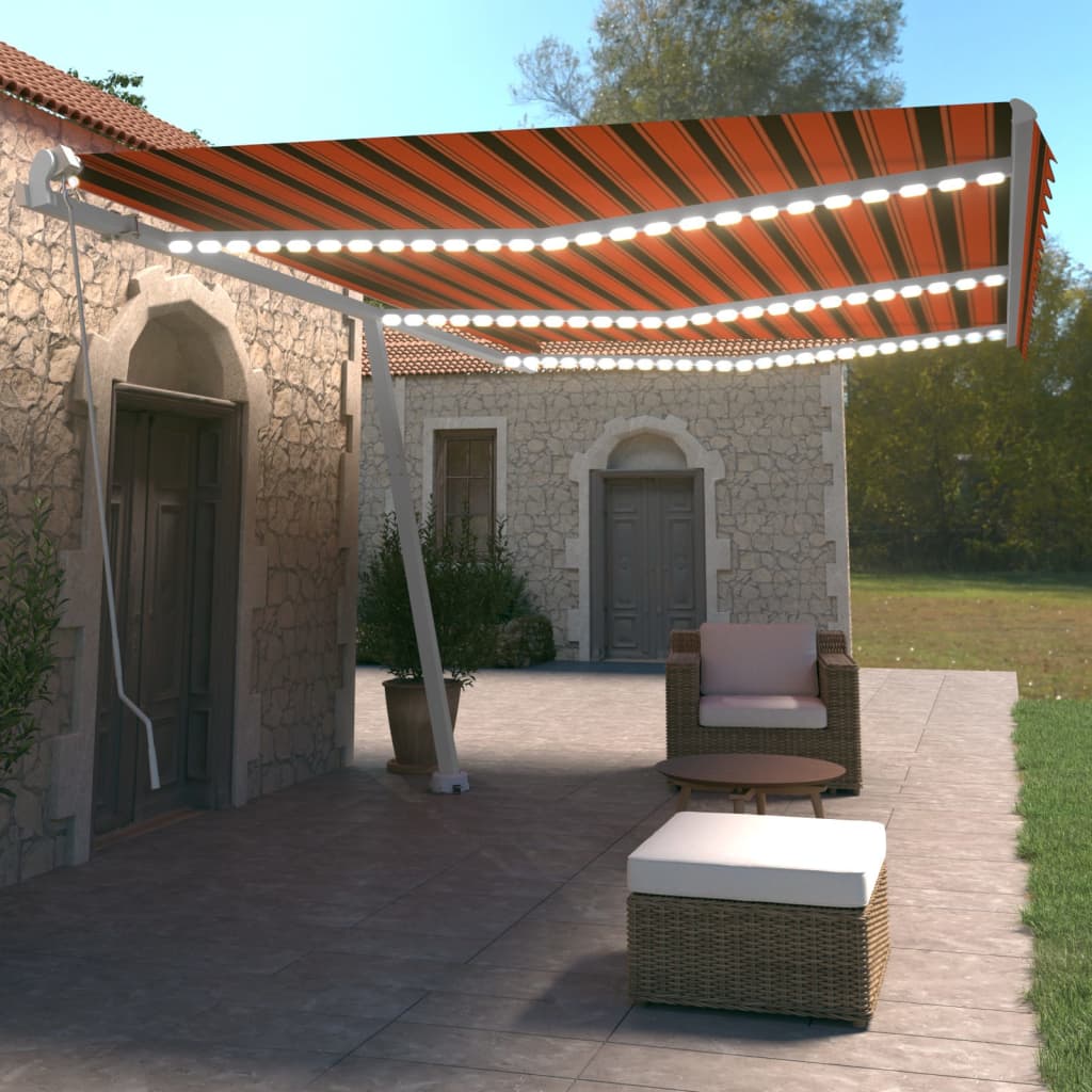 Vidaxl Luifel estendibile manualmente con arancione LED 600x350 cm e marrone