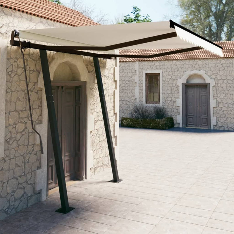 Vidaxl Luifel estendibile manualmente con pali 3x2,5 m crema