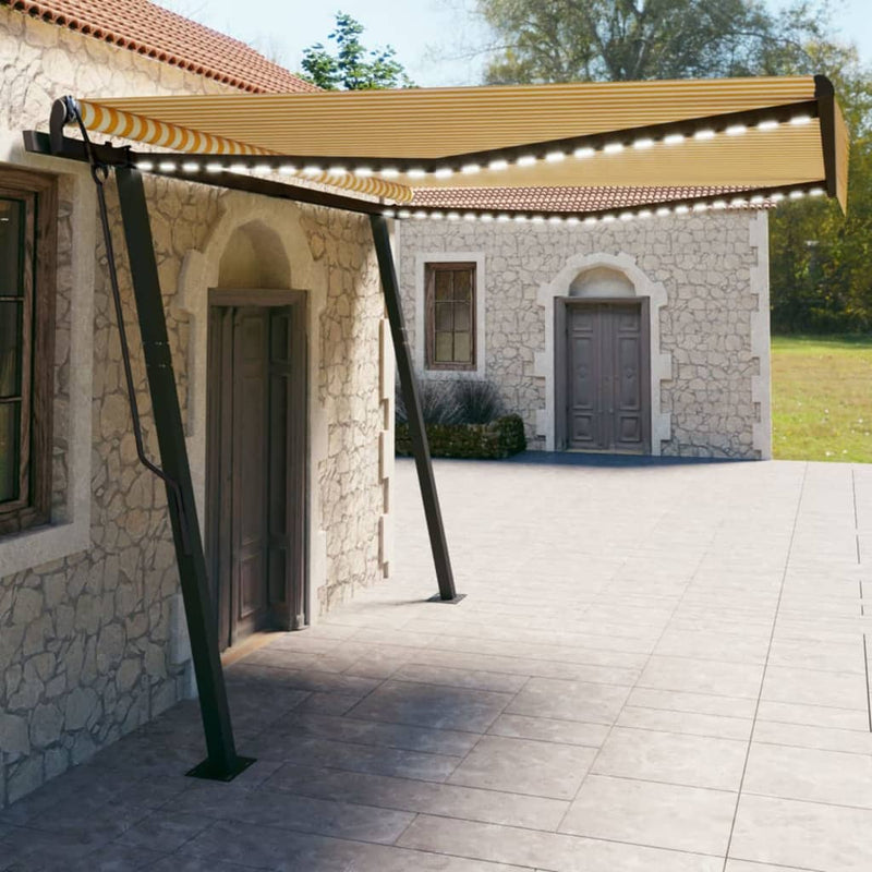 Vidaxl Luifel estendibile manualmente con LED 4x3 m giallo e bianco