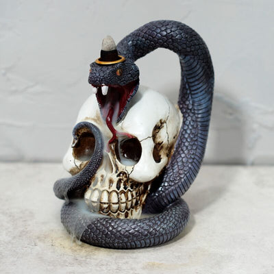 Soporte de incienso de la serpiente y el cráneo