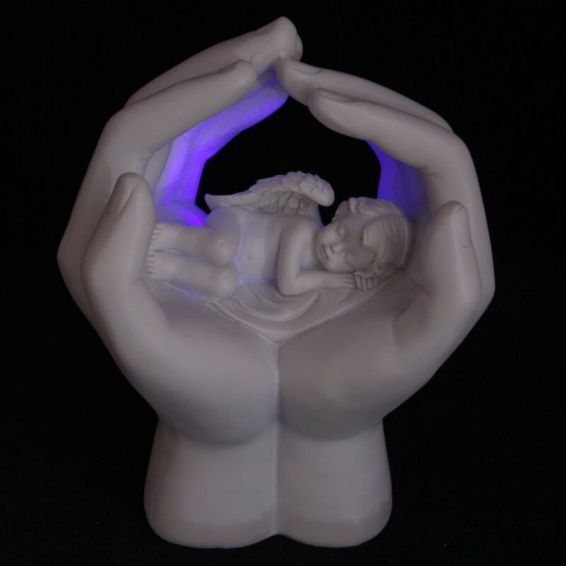 Cherubino addormentato nelle mani con LED
