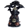 Ganesh in oro nero seduto sotto l'albero