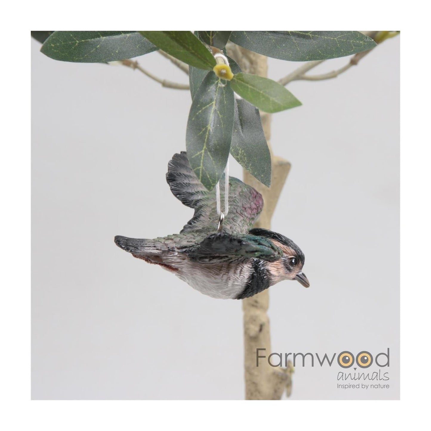 Animales de granja pájaro avefría volando